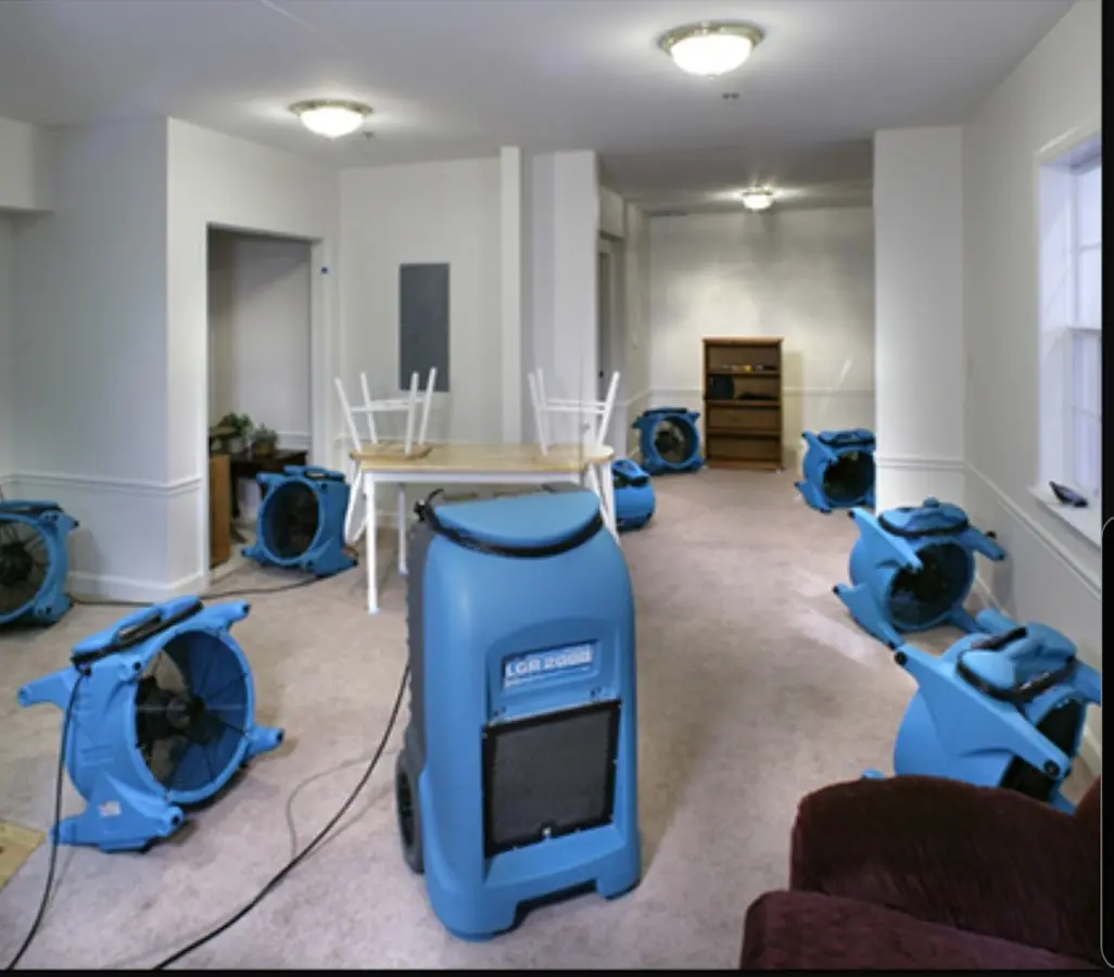 Air movers and dehumidifier setup for Water Damage Restoration in Newport